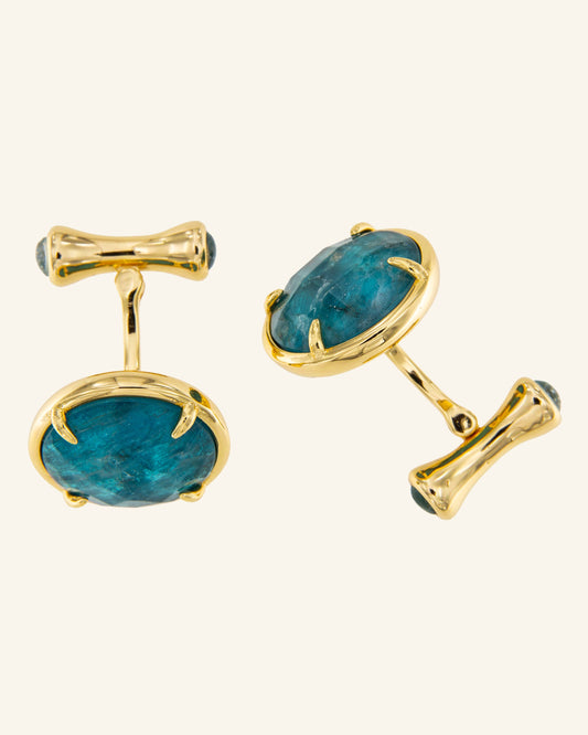 Golden astronaut cufflinks with blue apatite